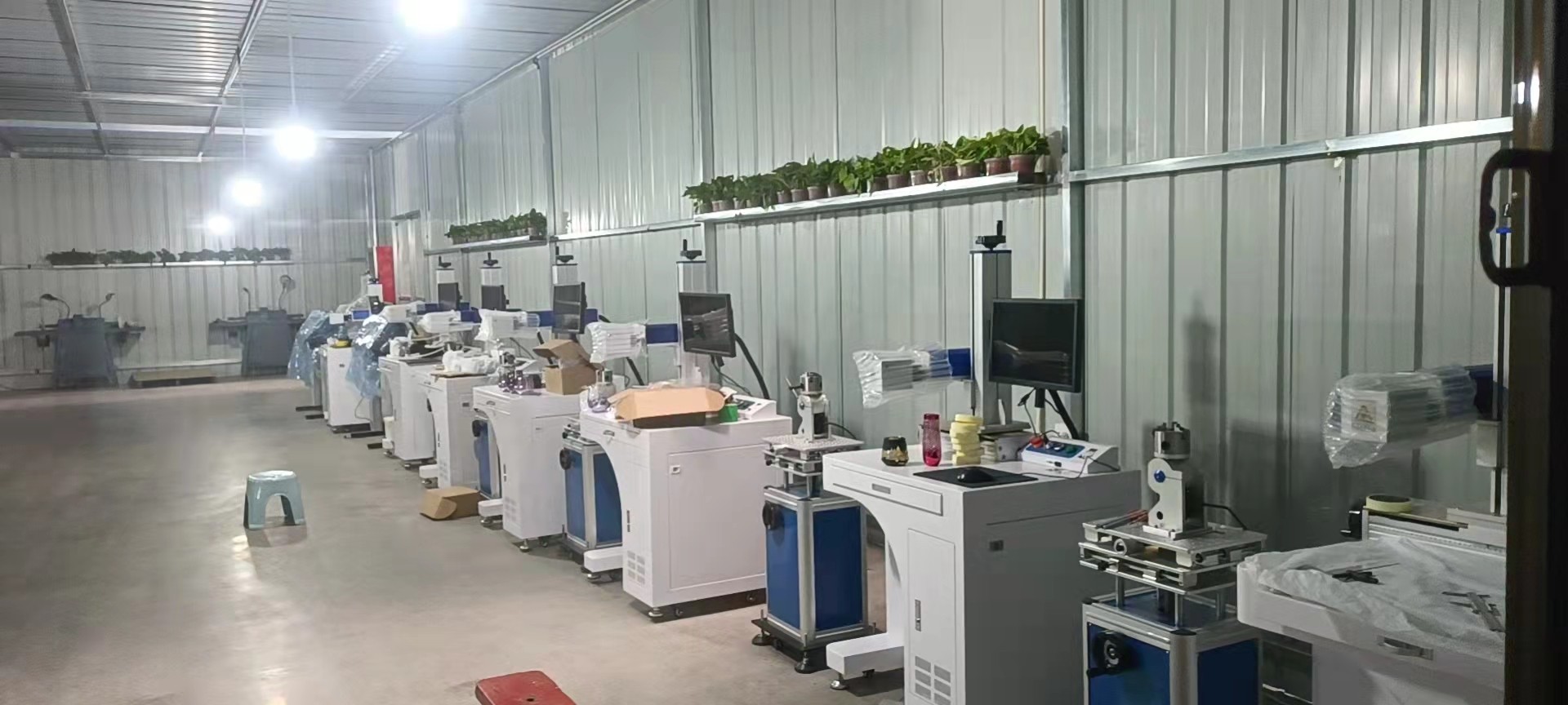 Automated laser engraving machine workshop at Jingyue Glass